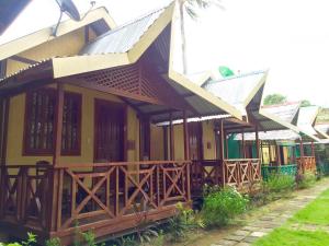 a house with a porch at Pems Pension and Restaurant in Taytay