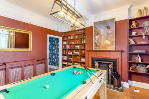 a pool table in a room with a fireplace at The Haven, Leyburn in Leyburn
