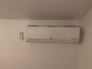 a white appliance on a wall in a room at Verliefd in Brustem in Sint-Truiden