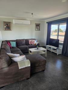 a living room with a couch and a table at Wudinna Crow's Nest in Wudinna