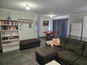 a living room with a couch and a table at Wudinna Crow's Nest in Wudinna