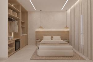 a bedroom with a large bed and some lights at Theera by Premium Key in Skiathos