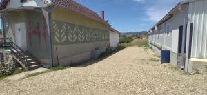 a building with a mural on the side of it at My Way in Vladičin Han