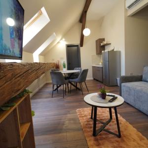 a living room with a couch and a table at Elidon 1833 in Pančevo