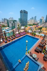 an overhead view of a large swimming pool in a city at Okay Boutique Hotel in Phnom Penh