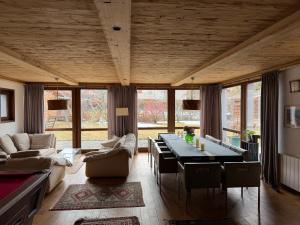 a living room with a table and a couch at Chalet l'Aiglon in Saint-Gervais-les-Bains
