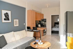 a living room with a couch and a table at CALLI HOUSE in Preveza
