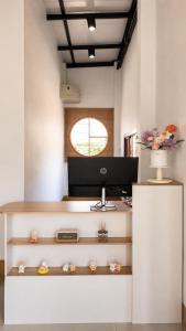 an office with a desk with a computer on it at OneVillaResort in Ban Son Tap Tao