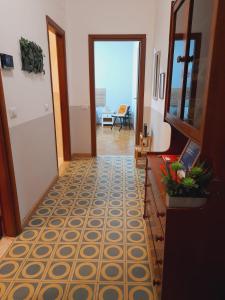 a hallway with ailed floor and a door to a room at BGM apartment Rho Fiera Milan in Cesate