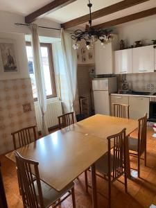 a kitchen with a large wooden table and chairs at La Vertecena in Cantalupo nel Sannio