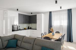 a living room with a couch and a table at Villa Vallis in Nedeščina