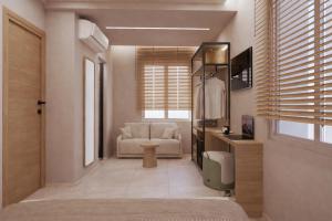a living room with a couch and a chair at Theera by Premium Key in Skiathos
