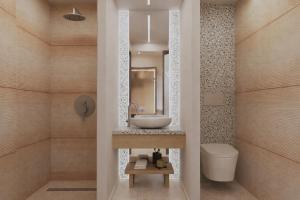a bathroom with a sink and a toilet at Theera by Premium Key in Skiathos +11 photos