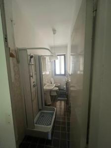 a bathroom with a sink and a toilet and a mirror at La Vertecena in Cantalupo nel Sannio