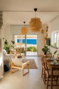 a living room with a view of the ocean at Cozy beach house in Perivolia
