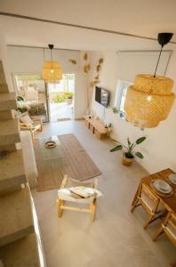 a large living room with a table and chairs at Cozy beach house in Perivolia