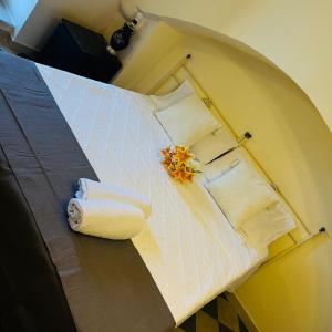 a room with a bed with towels on it at Santa Cesarea Sassi in Matera +39 photos