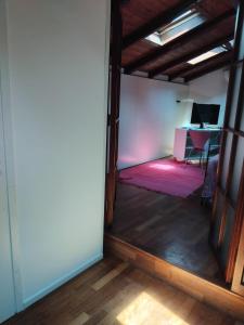 an open door to a room with a table in a room at Sogni in soffitta in Casalecchio di Reno