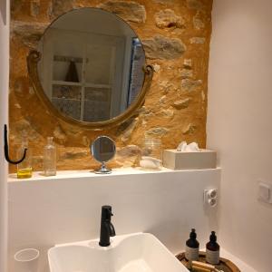 a bathroom with a sink and a mirror at Au Canari gîte de charme in Saint-Sauveur-en-Puisaye +29 photos