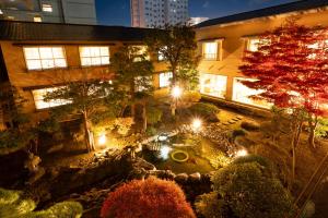 an overhead view of a garden at night with lights at Ryokan Ichinomatsu in Hakodate
