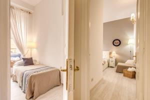 A bed or beds in a room at Vatican Miracle Suite