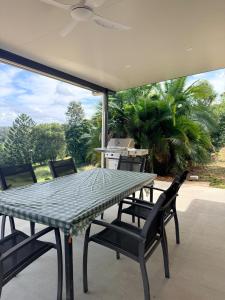 a table and chairs sitting on a patio at Valley View House in Gympie