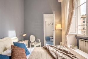 A bed or beds in a room at Vatican Miracle Suite
