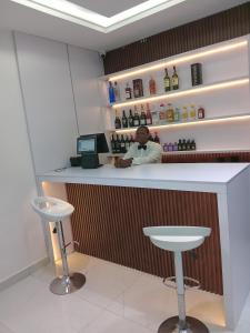 a man sitting at a counter in a bar at JKB PREMIUM lUXURY in Lekki