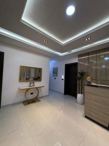 a large room with a table and a mirror at JKB PREMIUM lUXURY in Lekki