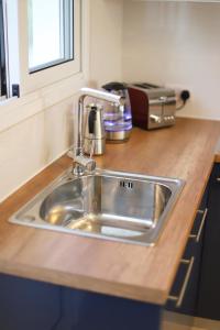 a kitchen counter with a sink and a toaster at Cozy beach house in Perivolia +117 photos