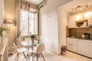 A kitchen or kitchenette at Vatican Miracle Suite