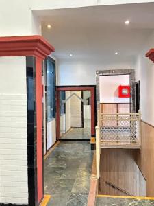 a hallway of a building with at Status Business Hotel - Naveen Market in Kānpur