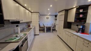a kitchen with a table and a dining room at Ferienwohnung Altrichter 1 in Wabern