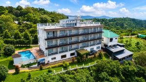 an aerial view of the inn at the mountain resort at Pleasant Hill Resort - Munnar in Munnar
