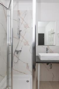 a bathroom with a shower and a sink at Garden Hotel in Zagreb +70 photos