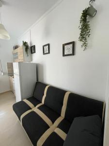 a living room with a couch and a refrigerator at Apartment Bella 2 Perea in Perea