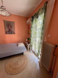 a bedroom with a bed and a window and a rug at Apartment Bella 2 Perea in Perea +6 photos