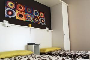 Postel nebo postele na pokoji v ubytování B&B I Tre Sensi