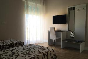 TV a/nebo společenská místnost v ubytování B&B I Tre Sensi