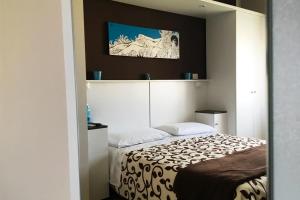 Postel nebo postele na pokoji v ubytování B&B I Tre Sensi