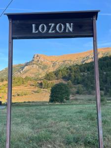 a sign that reads lion in a field at Casa Luigina in Verrayes