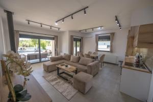 a living room with a couch and a table at Drina Lux in Loznica
