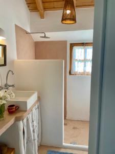 a bathroom with a sink and a window at Bombom Comporta in Melides +22 photos