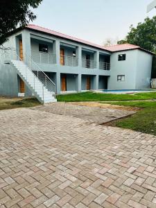 a building with a staircase in front of it at Rest Easy Guest House Pty Ltd Unit 5 in Boksburg