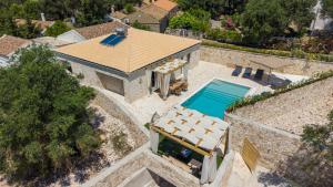 an overhead view of a house with a swimming pool at TS Luxury villa in Velianitátika