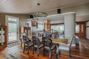 a kitchen and dining room with a table and chairs at Art & Soul Main House in Lyndhurst