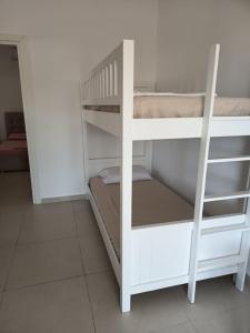 a couple of bunk beds in a room at Anna! in Ksamil