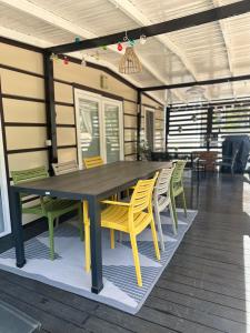 a table and chairs in a room with a table and chairs at Mobile home SIMS in Biograd na Moru +22 photos