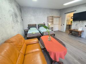 a living room with a couch and a table at Villa Topaz in Capoterra