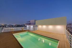 a swimming pool on the deck of a ship at Click Collection Aster, Raja Park - Jaipur in Jaipur
